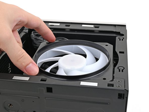 Align the screw holes on the fan duct with the ones on the fan.