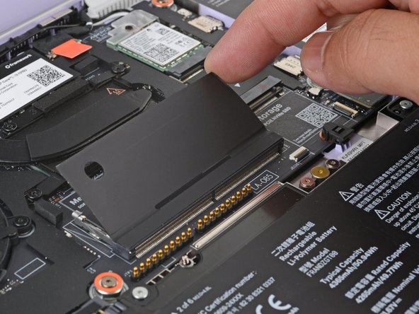 The next three steps show how to install the memory module.