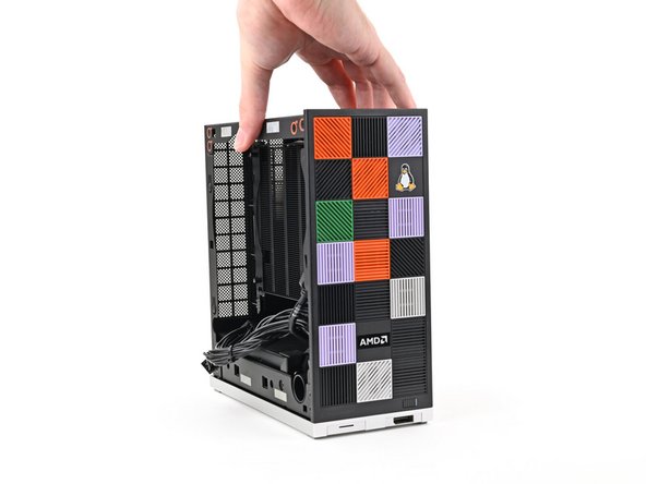 Lay the right side of the Desktop on your work surface so the Mainboard is facing upward.