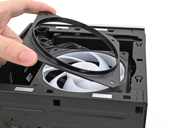 Lay the fan duct on top of the fan with the lip facing upward.