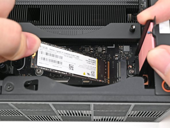 Hold the SSD by its edges. Don't touch the gold contacts with your fingers. If you do, wipe the contacts with a clean, lint-free cloth to remove any finger oils.