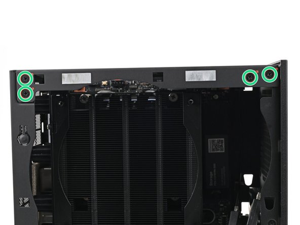 While holding the Desktop steady, use your Framework Desktop Screwdriver to install the eight 4.0 mm‑long Phillips screws securing the top plate.