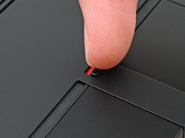 The latch displays a red bar when it's unlocked.