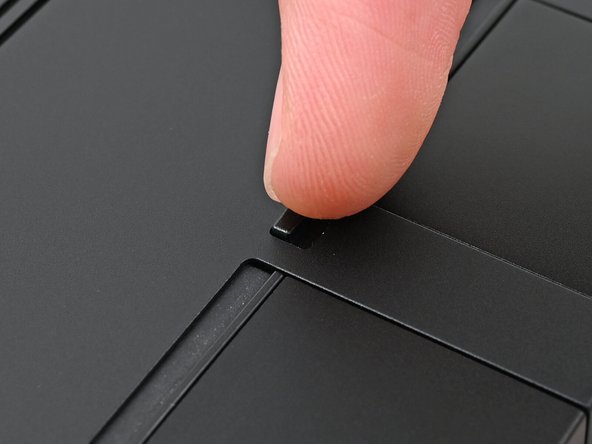 Use your finger to flip the Expansion Card latches into the unlocked position.