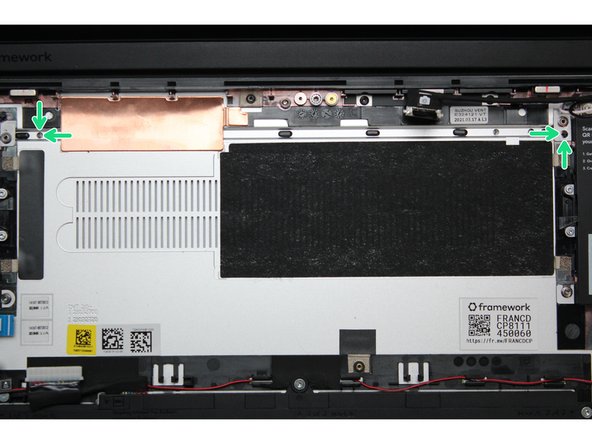 Take a close look at the actual Mainboard and you'll notice two small holes. You will see one hole on the top right and the other on the top left-hand side of the Mainboard as indicated in the first image with the orange arrows.