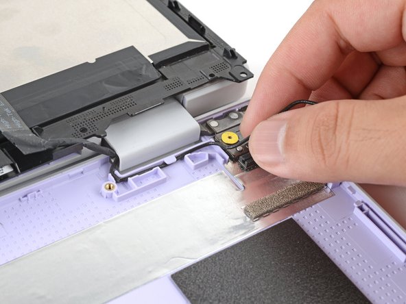 Repeat the previous step to guide the black antenna cable out of its channel.