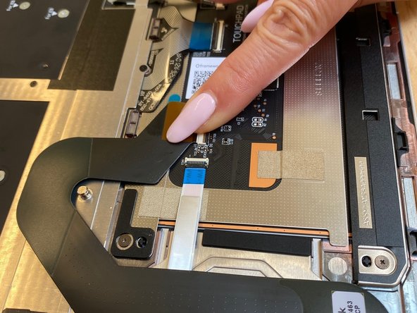 Once inserted, close the black latch to secure  the connector as in the second image.