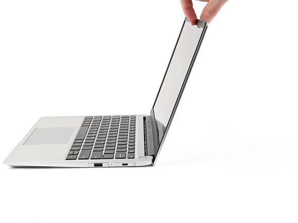 Open the laptop so the screen sits flat on your work surface.