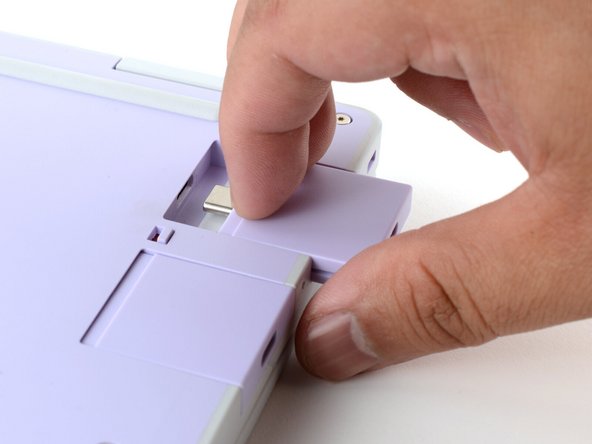 Pull the Expansion Card out of its slot and remove it.