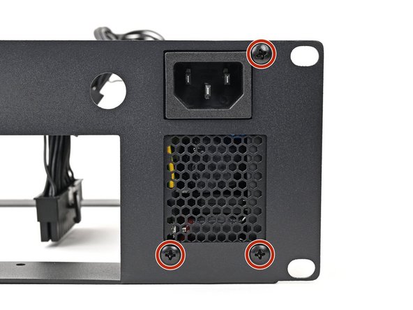 Use your Framework Desktop Screwdriver to install the three 6.0 mm‑long Phillips screws securing the power supply.