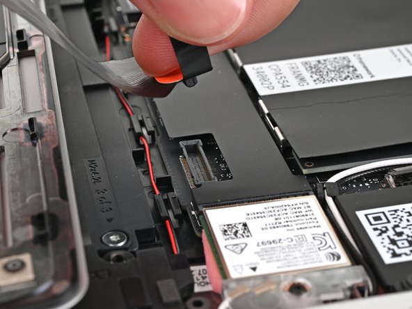 Lift up to disconnect the Touchpad Cable from the Mainboard.