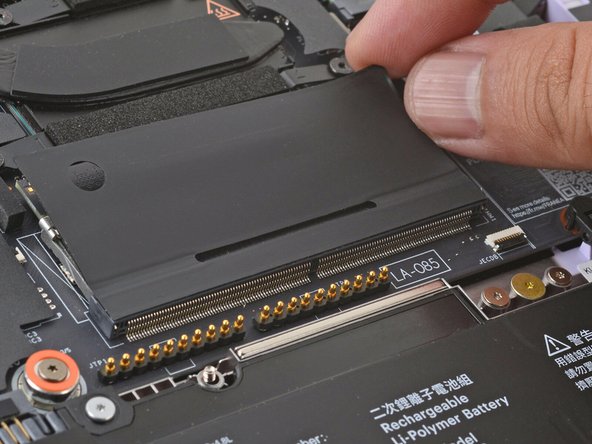 Use your fingers to flip open the memory flap.