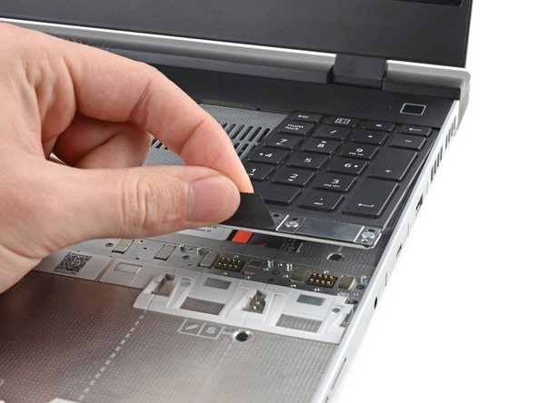 Grip the pull tab at the bottom of the Input Module and lift until its magnets release.