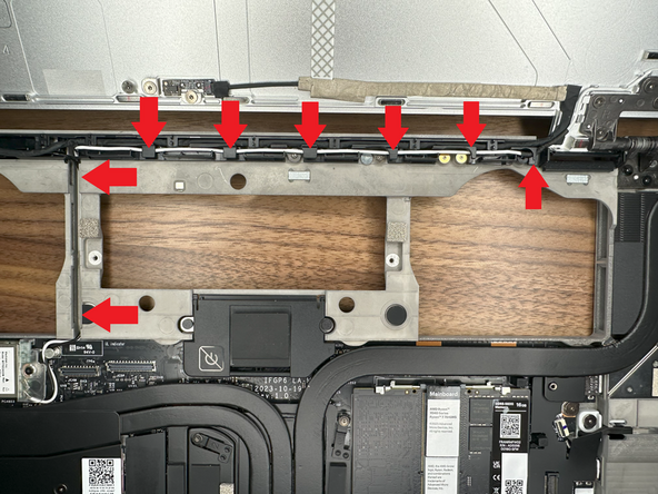 Route the White Antenna Cable through the right hinge; placing it in the front guided channel.