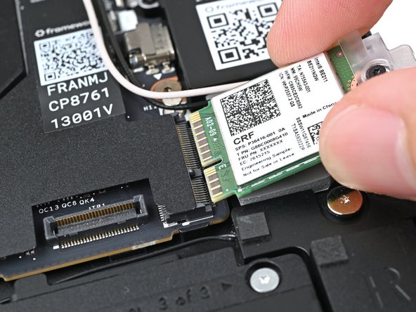 Don't pull the module too far from its socket, as it's still connected by two cables.