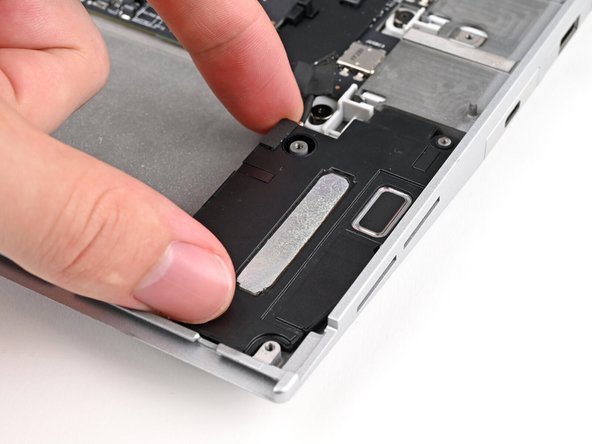 Lift the speakers off their alignment pegs and remove them.