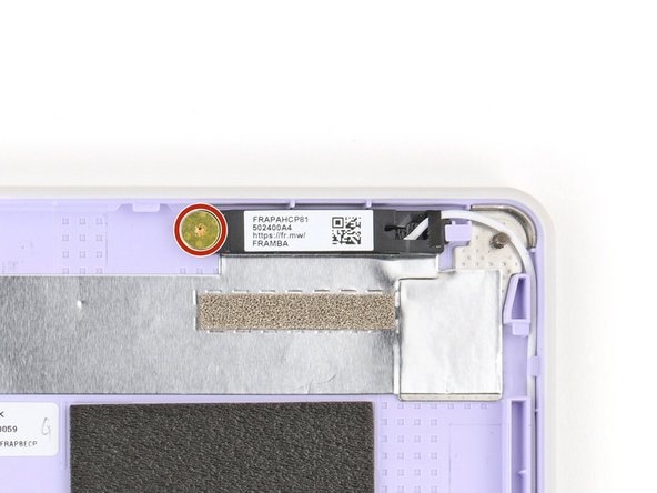 Use your Framework Screwdriver to remove the two 2.4 mm‑long T5 Torx screws securing the two antennas to the Top Cover.