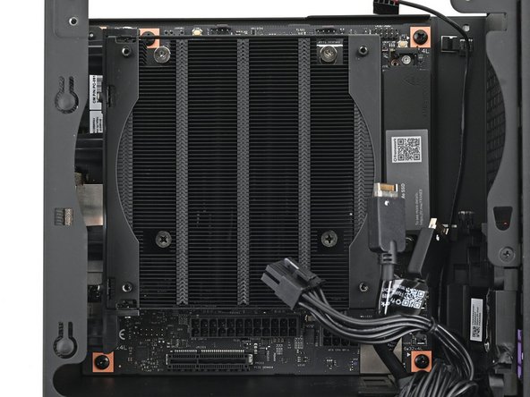 Use your Framework Desktop Screwdriver to remove the four 8.2 mm‑long Phillips screws securing the Mainboard.