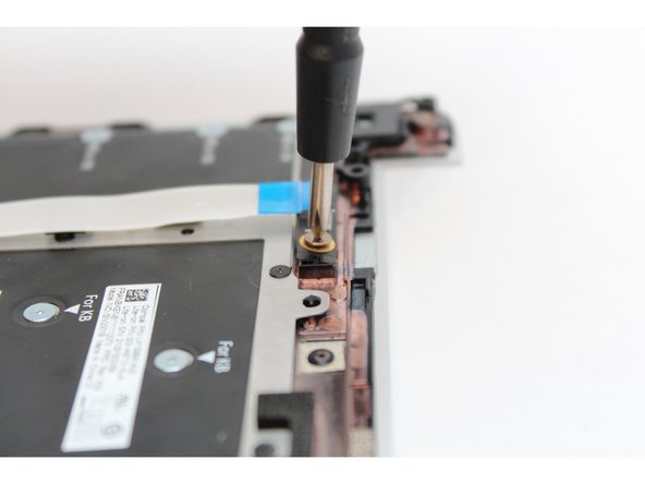 Using the PH0 bit in the Framework Screwdriver unscrew the fastener on the Fingerprint Module.
