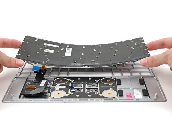 Place the Keyboard into its cutout in the Top Cover.