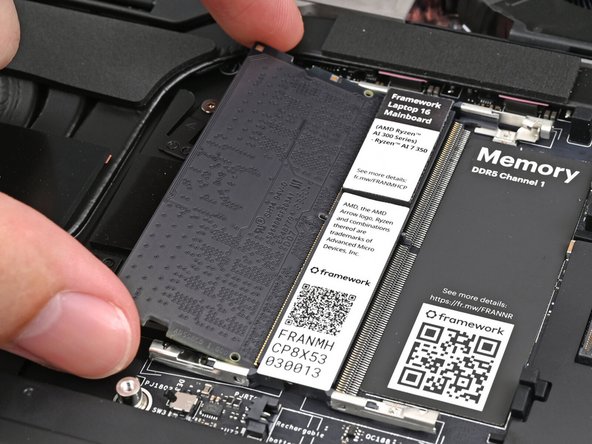 Orient the module with its label facing down and align the gold contacts with the left socket labeled DDR5 Channel 0.