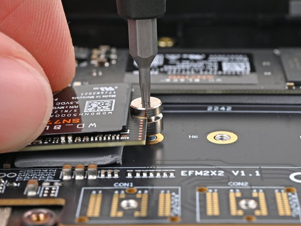 The head of the screw should completely cover the notch and its threads should slot into the adapter's screw hole.