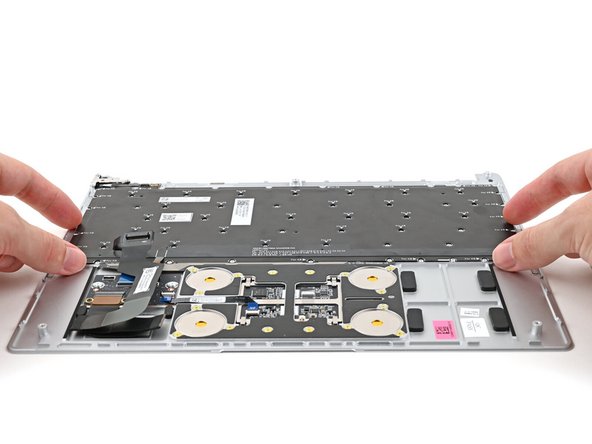 Place the Keyboard into its cutout in the Top Cover.