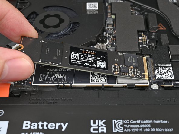 Hold the SSD by its edges. Don't touch the gold contacts with your fingers. If you do, wipe the contacts with a clean, lint-free cloth to remove any finger oils.