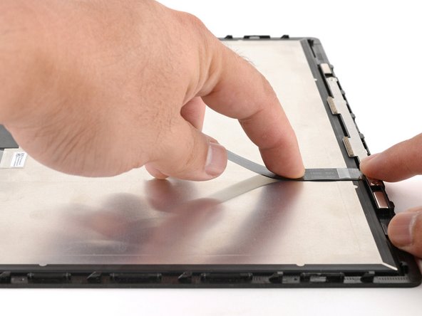 If the webcam cable has any plastic liners covering adhesives, peel them off to expose the adhesives. These liners should peel easily from the cable.