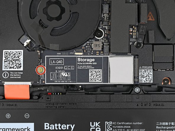 Use your Framework Screwdriver to remove the 3.0 mm‑long T5 Torx screw near the SSD connector.