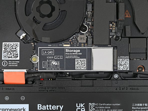Use your Framework Screwdriver to remove the 3.0 mm‑long T5 Torx screw near the SSD connector.