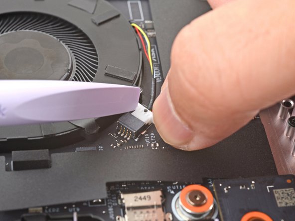 Use your fingers and your Framework Screwdriver to slide the fan connector out of its socket.