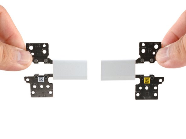 Lift and remove both hinges from the Top Cover.