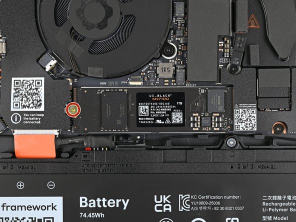 While holding the SSD flat to the Mainboard, use your Framework Screwdriver to install the 3.0 mm‑long T5 Torx screw securing the SSD.