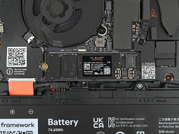 While holding the SSD flat to the Mainboard, use your Framework Screwdriver to install the 3.0 mm‑long T5 Torx screw securing the SSD.