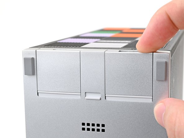 The Expansion Cards should click into place, and the front edge should be flush with silver base.