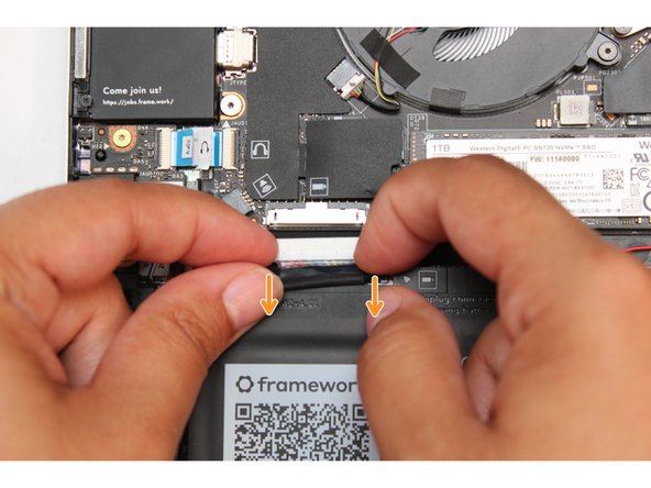 Gently disconnect the Battery by gripping the connector edges with both fingers and slide the connector straight down from the socket.