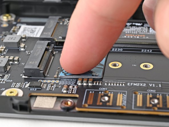 Use your finger to gently press the thermal pad onto the adapter.