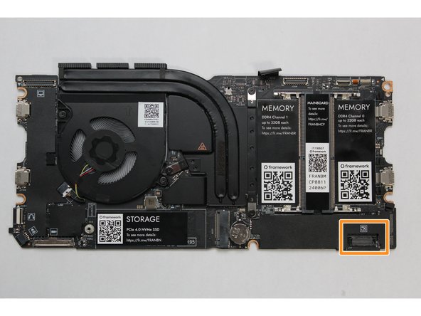 Using slight force, connect the Touchpad Cable by aligning it to the socket on Mainboard.  You should hear it click into place once properly connected.