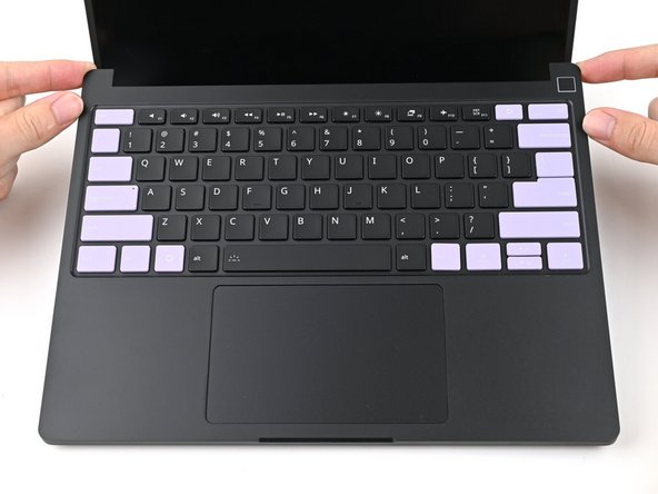 Lay the Input Cover over the laptop and let the magnets snap it into place.