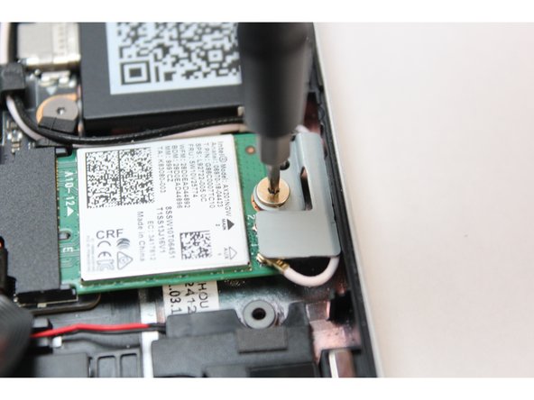 Remove the fastener and gently lift off the WiFi Bracket.