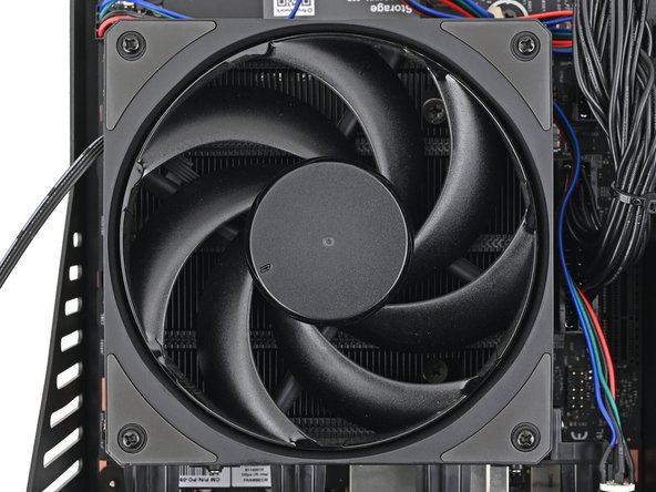 Use your Framework Desktop Screwdriver to install the four 27.3 mm‑long screws securing the fan.