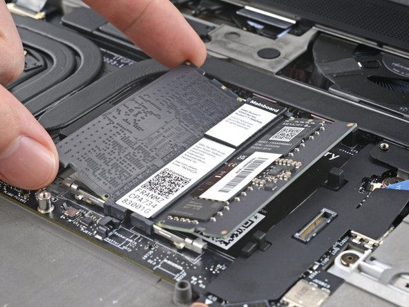 Slide the RAM stick out of its socket and remove it.