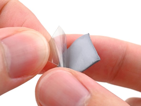 Remove the clear liner from the thermal pad to expose one side of it.