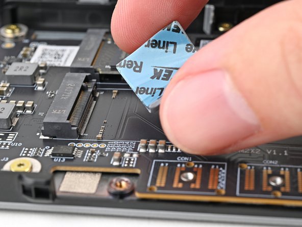 Place the thermal pad over its spot on the adapter.