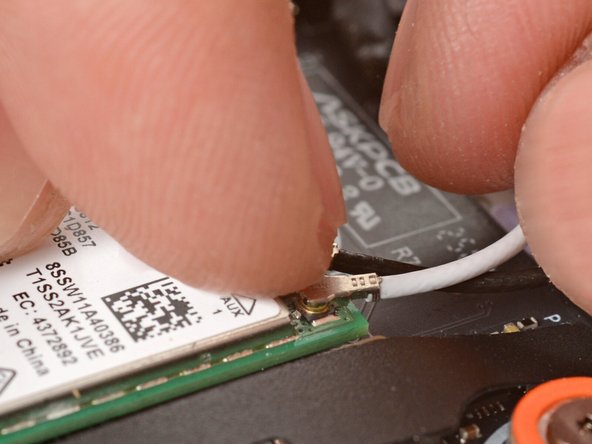 Tweezers can help position the connector.