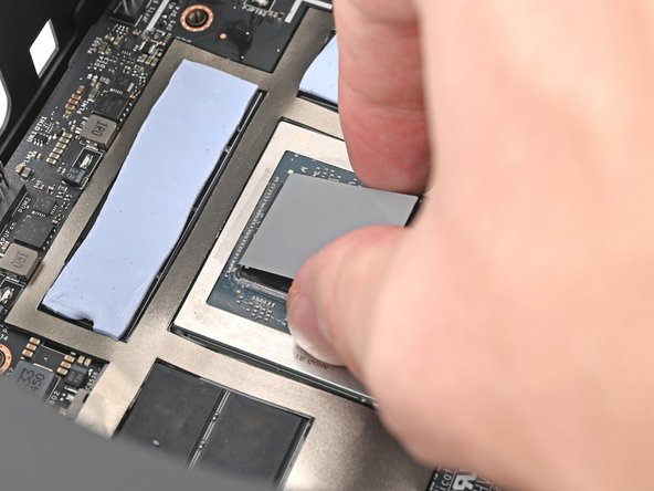 Place the exposed side of the thermal pad over the APU and press it into place.