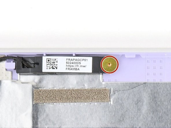 Use your Framework Screwdriver to install the two (one per antenna) 2.5 mm‑long T5 Torx screws to secure the antennas to the Top Cover.