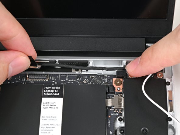 Refer to this photo for how the cable should look when properly routed.