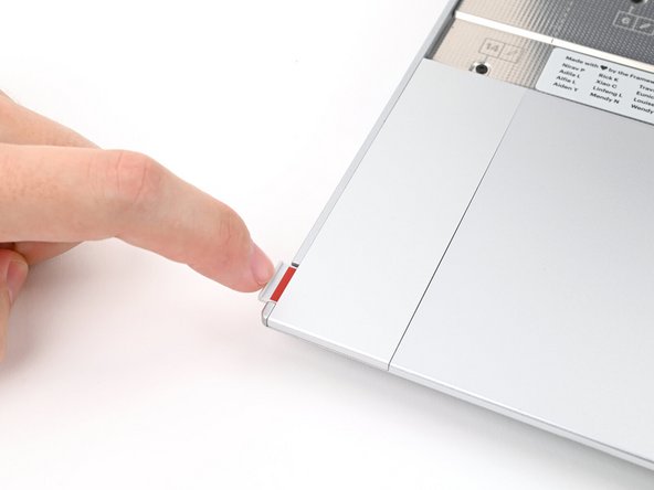 Repeat the previous two steps to remove the other Touchpad Spacer.